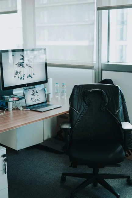 services-04 person-in-blue-long-sleeve-shirt-sitting-beside-black-laptop-computer-9gpkrsbgmc